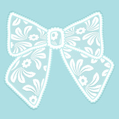 Decorative lacy bow on blue background