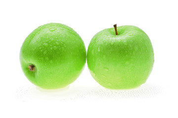 Apple green with water drops isolated on white background.