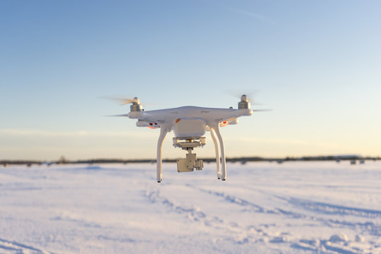 Camera drone at winter evening with selective focus