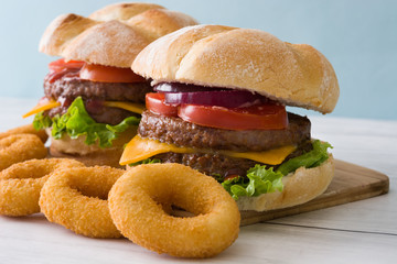 Delicious cheeseburgers and onion rings
