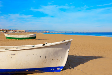 Fototapeta premium Valencia La Malvarrosa beach boats stranded