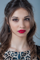 Beautiful woman face close up portrait young studio on gray. Natural beauty