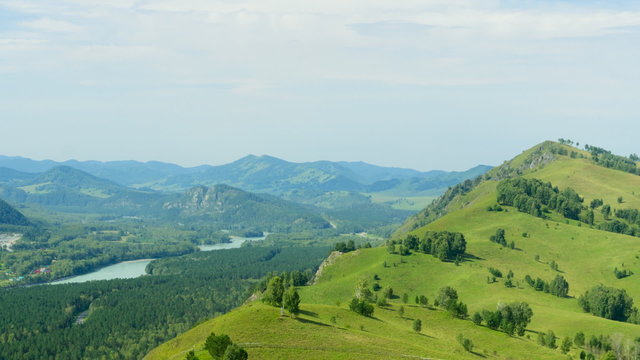 Aeiral view of beautiful mountain landscape in a summer day. Timelapse video.