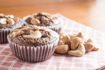 Cup of Brownies With Cashew nuts On Wooden Background