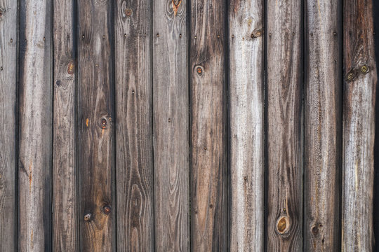 Vintage wood background. Grunge wooden weathered oak or pine textured planks. Rustic brown rustic fence.