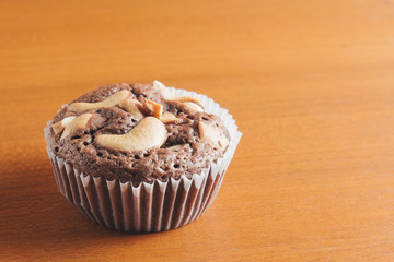 Cup of Brownies With Cashew nuts On Wooden Background