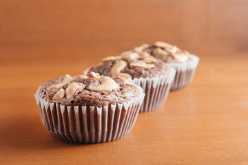 Cup of Brownies With Cashew nuts On Wooden Background