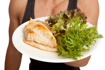 Clean food on plate in Muscular Asian man hand