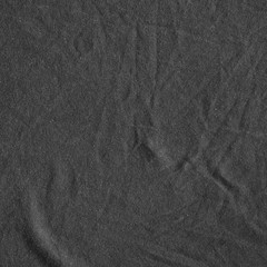 Naklejka premium Black canvas with delicate striped pattern, crumpled.