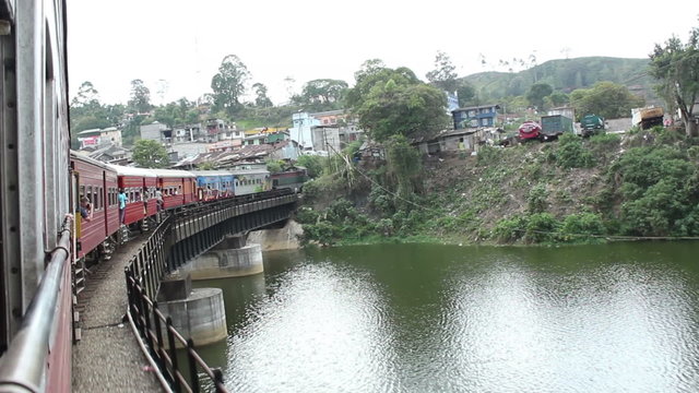 A train goes across a bridge in Sri Lanka.