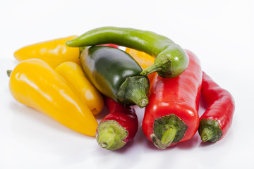 heap of colorful raw chili pepper isolated on white background