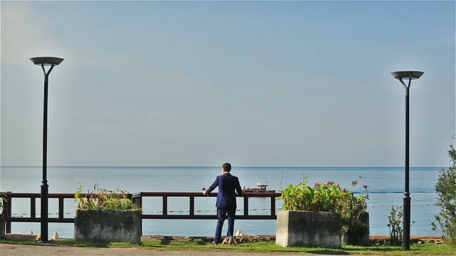 Stylish groom enjoying the view of Montenegro, Budva