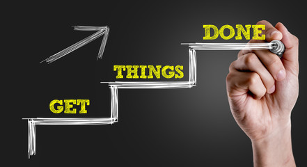 Hand writing the text: Get Things Done