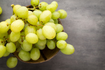 Grape cluster on the grey background.