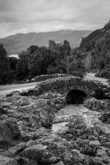 Tourist popular Ashness Bridge in the English Lake District on a moody cloudy day.