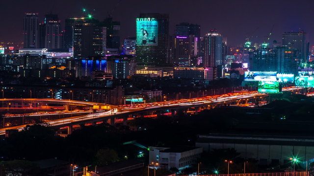 4K TimeLapse.  Night view of the city and highway