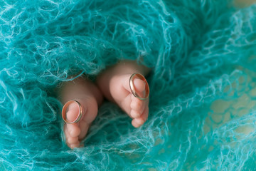 Cute feet of a newborn girl