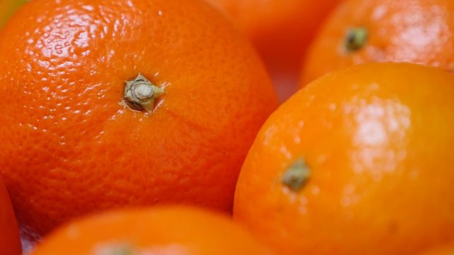 Fresh tangerines on plate healthy fruit orange background 1080p FullHD video - Slow tilt on food and fruit mandarine on table 1920X1080 HD footage 