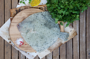 fresh raw flounder, tubot f on the cutting board
