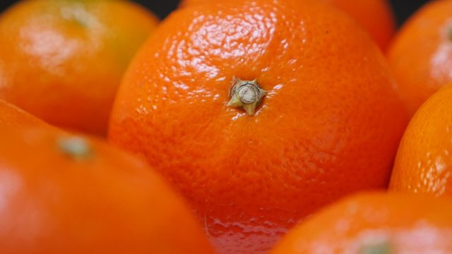 Lot of fresh tangerines on plate healthy fruit orange background 1080p FullHD video - Slow tilt on food and fruit mandarine on table 1920X1080 HD footage 