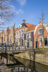 Colorful houses and a bridge at a canal in Franeker