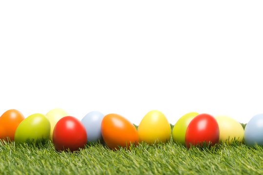 Colourful easter eggs on grass as template