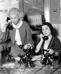 Two women working on a phone bank 