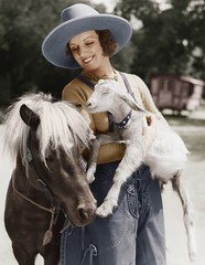 Woman with goat and pony  