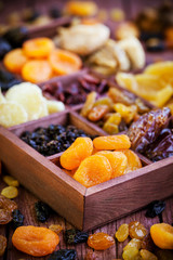 Аssorted dried fruits in wooden box