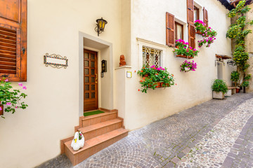 Picturesque small town street view in Limone, Lake Garda Italy. Entrance of an apartment or house.