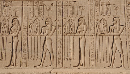 Parade of fertility offerings on the external walls of the Hathor Temple at Dendera