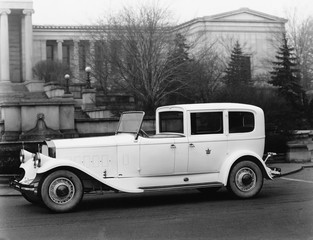 Classic car parked outside building 