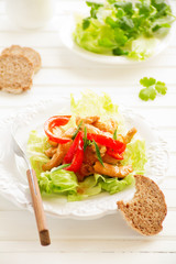 Roast chicken with vegetables and salad.