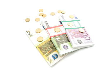 packs of different euro banknotes and coins