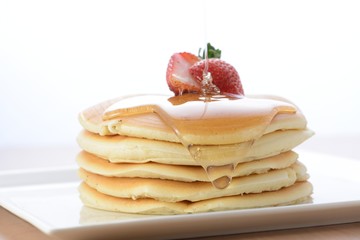 Pouring Honey to Pancakes
