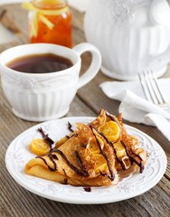 Pancakes with bananas and chocolate.