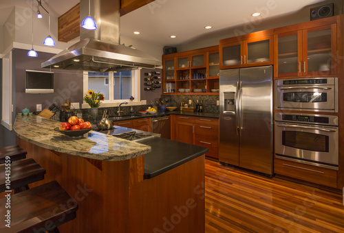 Contemporary Upscale Home Kitchen Interior With Wood Cabinets And