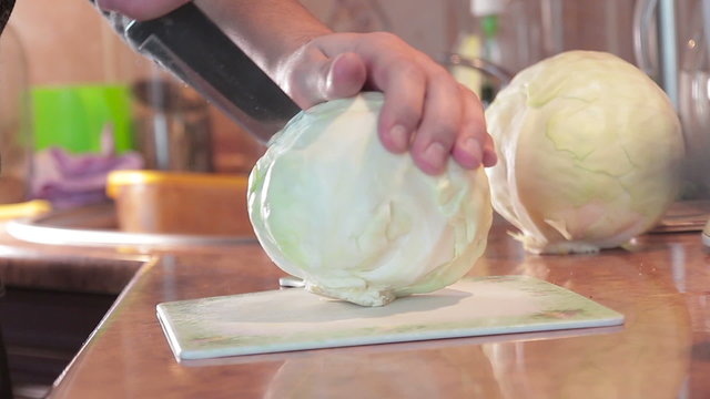 man cutting cabbage