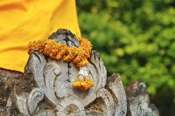 string of flowers to worship