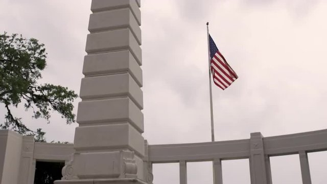 United States' flag blowing in the wind at Dealey Plaza, Dallas.
