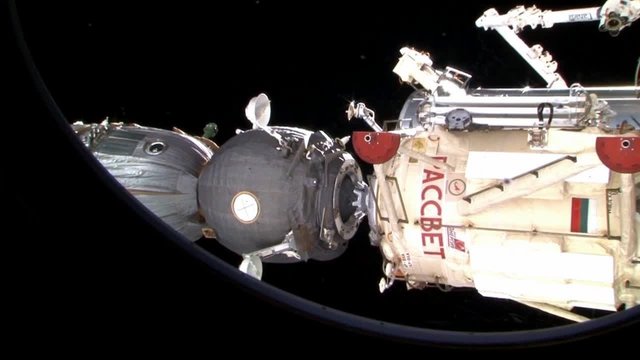 The Russian Soyuz spacecraft docks with the International Space Station.