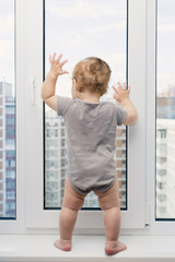 Child looking at window