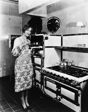 Woman with large stove 