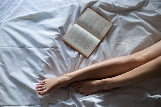 Book by the female legs