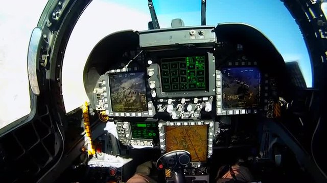 POV shots from the cockpit of a fighter plane includes instrument controls.