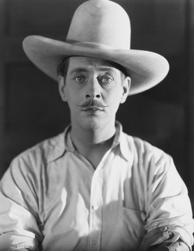 Portrait of man wearing cowboy hat 
