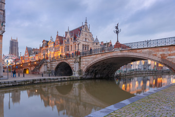 Picturesque medieval building and St. Michael's Bridge in the evening in Ghent, Belgium