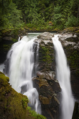 Nooksack Falls, Washington. A lovely waterfall that flows through a narrow valley and drops freely 88 feet into a deep rocky river canyon. In the Mt. Baker National Forest.