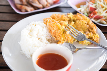 omelet served with steamed rice and chilli sauce on plate
