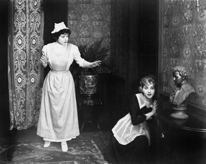 Woman caught eavesdropping at door 